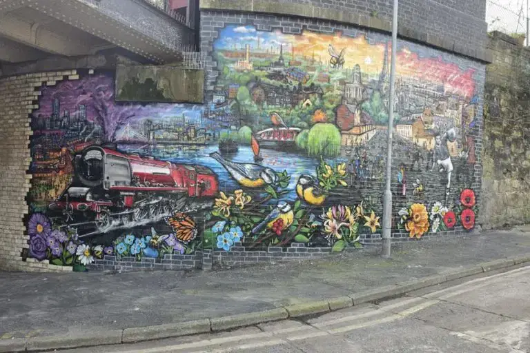 Giant new mural bringing Salford’s history to life under a city bridge