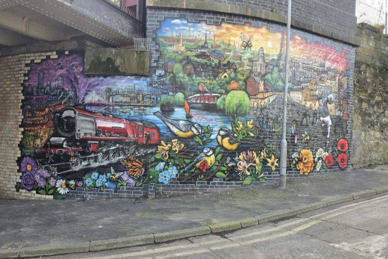 Giant new mural bringing Salford’s history to life under a city bridge